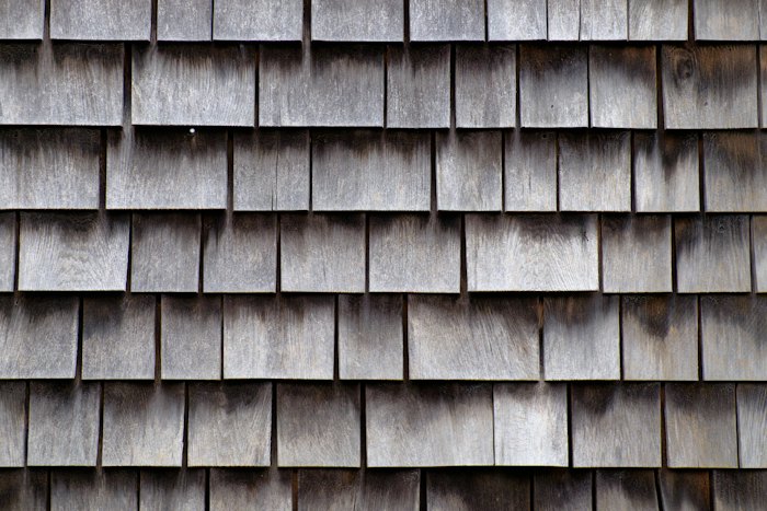 Weathered cedar shake roof shingles in close-up