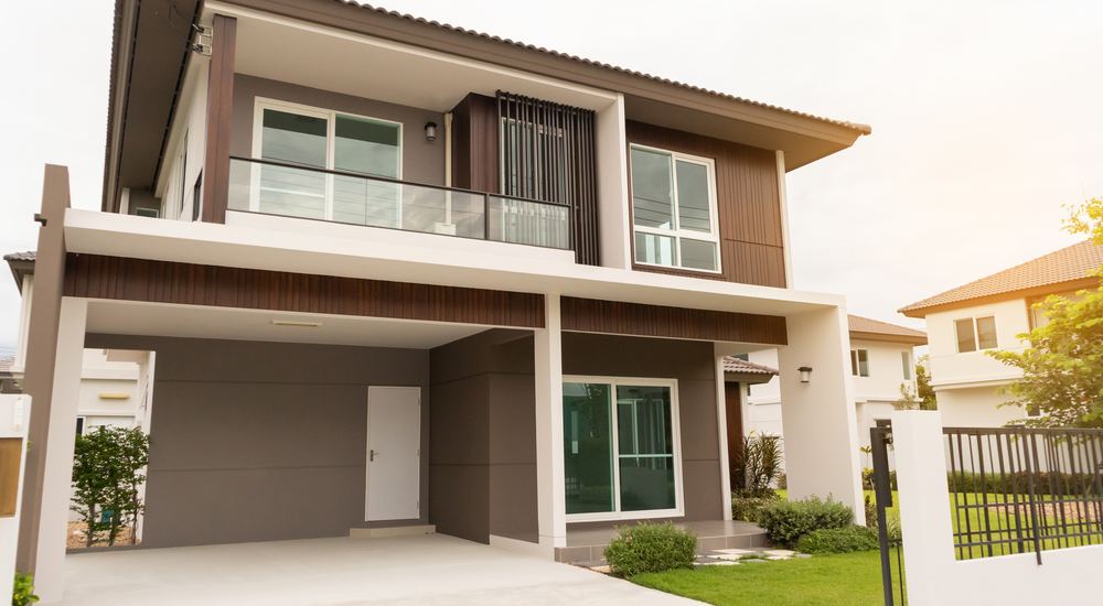 Stock photo of a suburban house exterior used in an illustrative fictional ad example